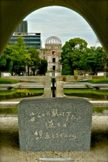 Memorial cenotaph to the atomic bomb victims looking through to Atomic Dome